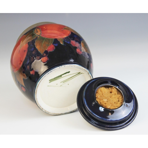 398 - A Moorcroft metal mounted tobacco jar and cover in the Pomegranate pattern on cobalt blue ground, ea... 