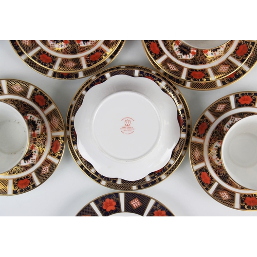 412 - A selection of Royal Crown Derby 1128 pattern tea wares, comprising: four teacups (dated 1989, 1991,... 