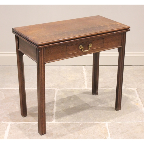 740 - A 19th century oak tea table, the rectangular moulded folding top above a single frieze drawer, rais... 