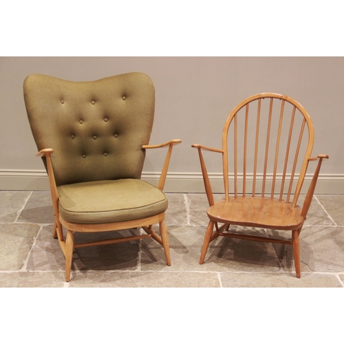 769 - An Ercol beech wood open armchair, in green fabric, the shaped button back extending to up swept arm... 