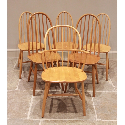 771 - A mid 20th century Ercol style blonde elm and beech wood kitchen table, the rectangular top on splay... 