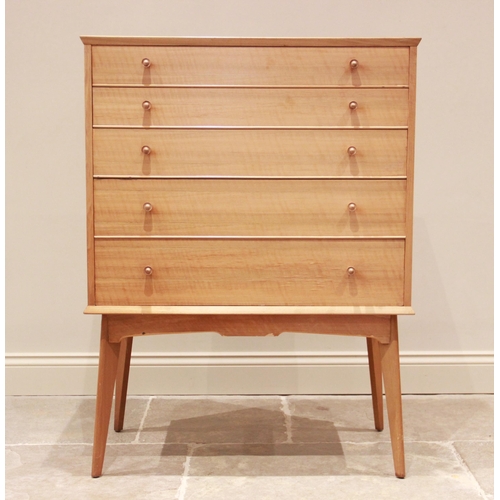 775 - A walnut chest of drawers by Alfred Cox for Maples, mid 20th century, comprising five graduated long... 