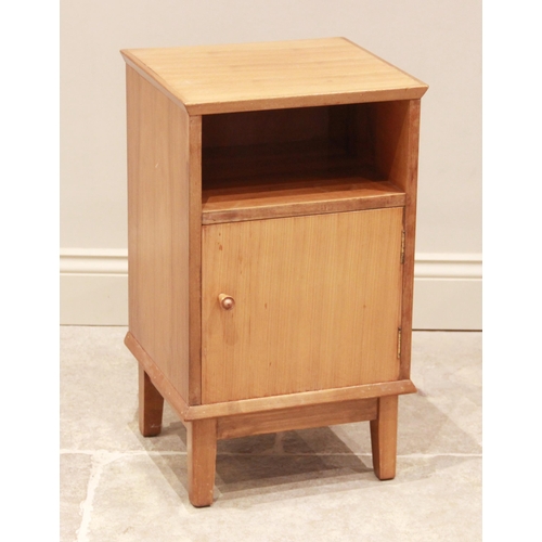 778 - A walnut bedside cabinet by Alfred Cox for Maples, mid 20th century, with open storage compartment o... 