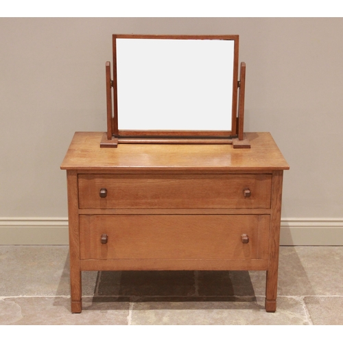 782 - A mid 20th century light oak chest of drawers by Russell of Broadway, maker's label to the rear of t... 