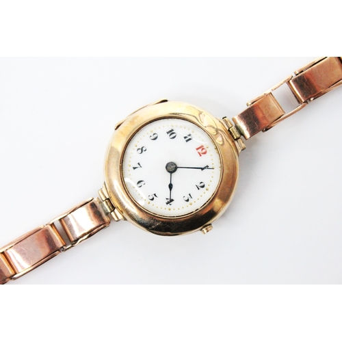 83 - A George V ladies 9ct gold wristwatch, the round white dial with Roman numerals, set to a plain poli... 