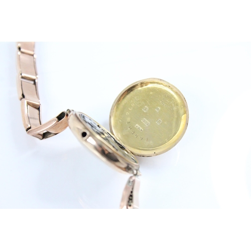 83 - A George V ladies 9ct gold wristwatch, the round white dial with Roman numerals, set to a plain poli... 