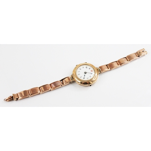 83 - A George V ladies 9ct gold wristwatch, the round white dial with Roman numerals, set to a plain poli... 