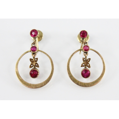 96 - A pair of Edwardian ruby and pearl set 15ct gold earrings, each designed as a round mixed cut ruby s... 