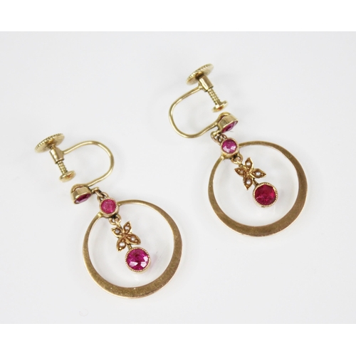 96 - A pair of Edwardian ruby and pearl set 15ct gold earrings, each designed as a round mixed cut ruby s... 