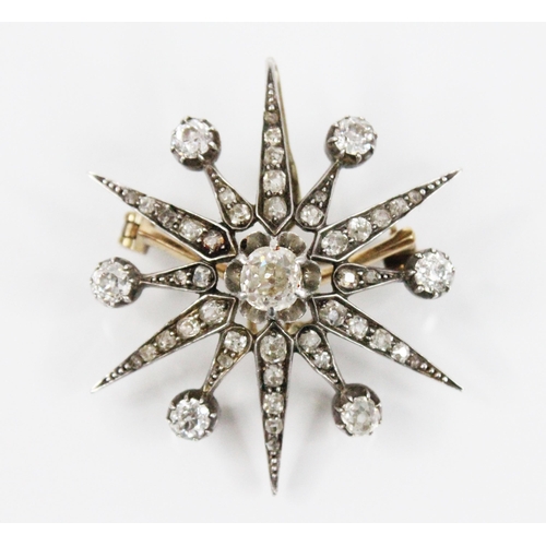 97 - A Victorian diamond necklace, designed as a diamond set starburst brooch pendant, with central old c... 