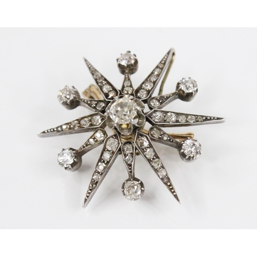 97 - A Victorian diamond necklace, designed as a diamond set starburst brooch pendant, with central old c... 