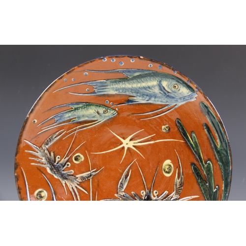 418 - A studio pottery earthenware footed bowl, late 20th century, of circular form, decorated with fish a... 