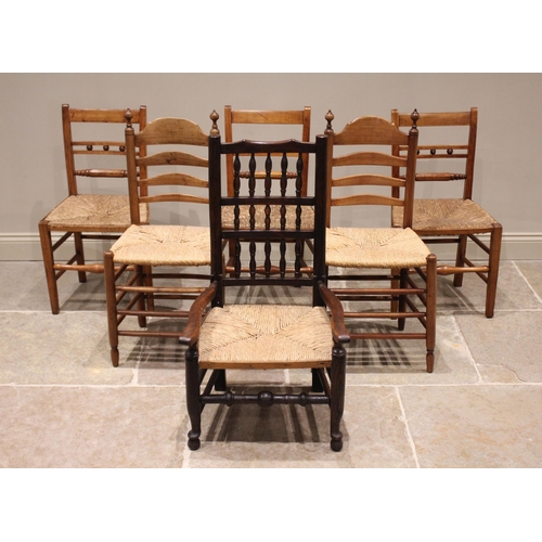 734 - Three 19th century fruitwood kitchen chairs, each with a rail back over an envelope rush seat, raise... 