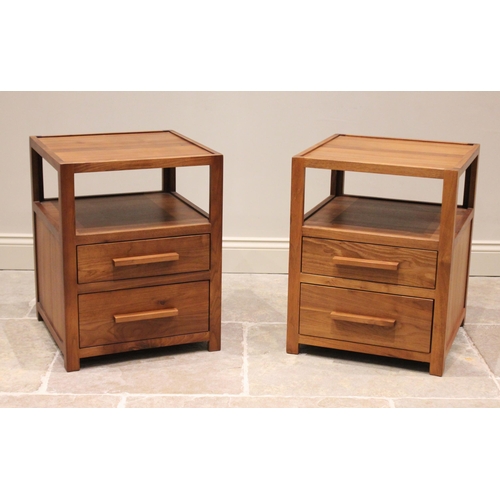 779 - A pair of walnut bedside chests, probably Heals circa 2000, each with two graduated drawers below an... 