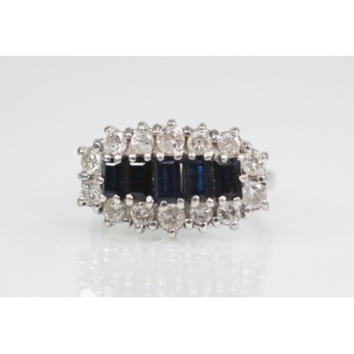 90 - A sapphire and diamond cluster ring, the central boat shaped cluster comprising five graduated bague... 