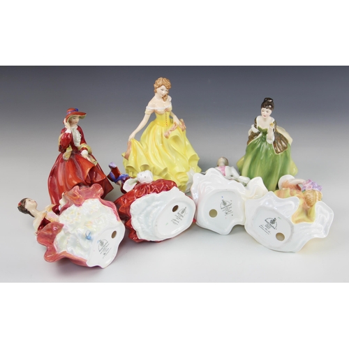 414A - Seven Royal Doulton figurines, comprising: HN3221 Country Rose, HN5322 Pretty Ladies Summer, HN1934 ... 