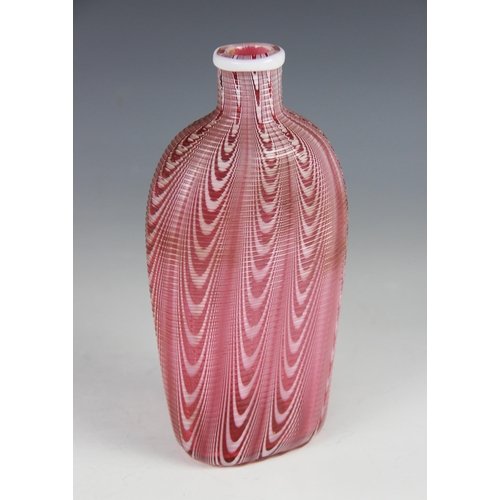 424 - A 19th century Nailsea type glass flask, trailed swag decoration in red and white hues, pontil to ba... 