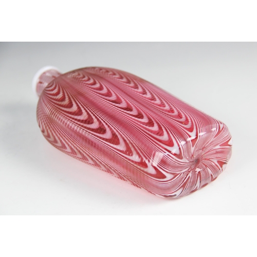 424 - A 19th century Nailsea type glass flask, trailed swag decoration in red and white hues, pontil to ba... 