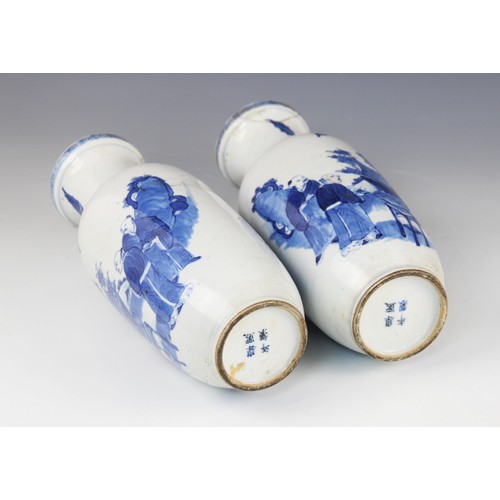 451 - A pair of Chinese blue and white vases, 19th century, each of baluster form and decorated to the ext... 