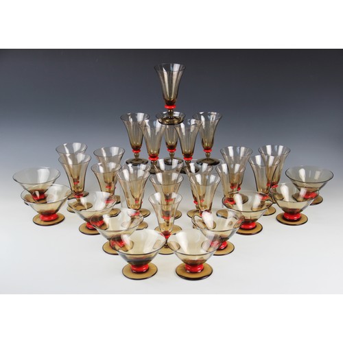 423 - A suite of Art Deco glassware, early 20th century circa 1930, each smoked glass of trumpet form with... 