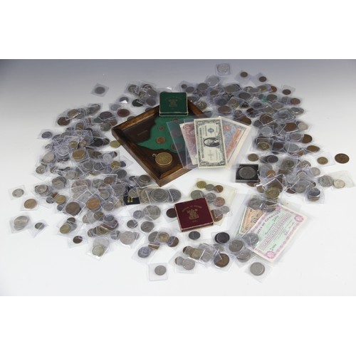 69 - A large collection of silver, cupro-nickel and bronze global coinage and banknotes, including a sele... 