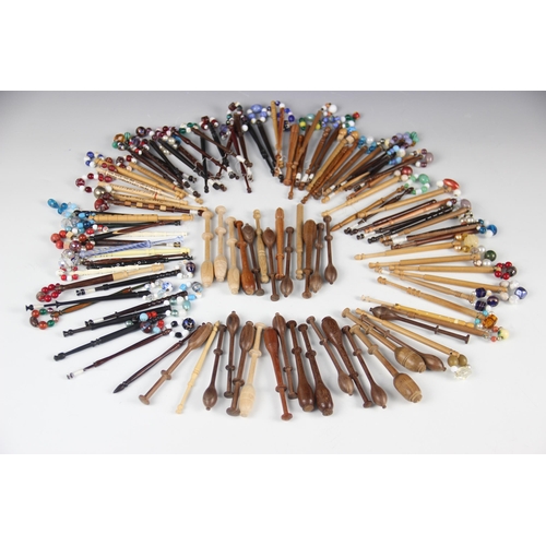 174 - A collection of lace bobbins, 19th century and later, the majority in various woods turned in tradit... 