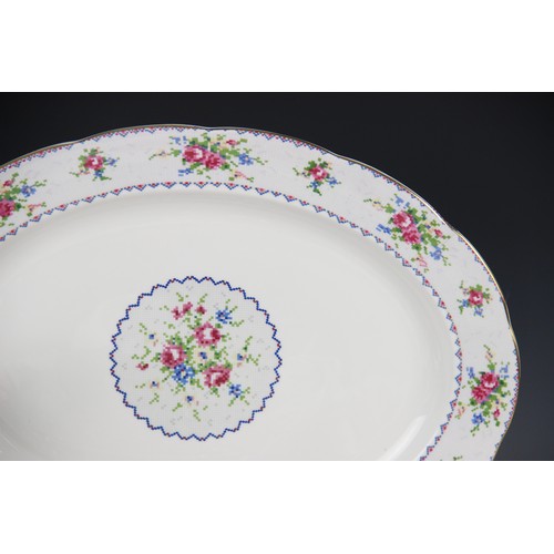 411 - A Royal Albert Petite Point part service, comprising eight dinner plates, 24.5cm wide, six dessert p... 