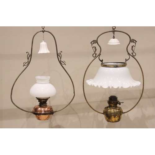 608 - A Victorian brass hanging oil lamp, with a brass oil reservoir and crimped opaline glass shade withi... 