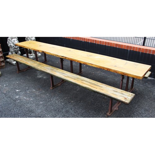 584 - A large Railway bench, early 20th century, with three cast iron supports below a later replaced ceda... 