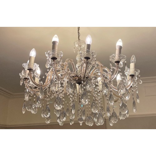 604 - A large 20th century French style crystal chandelier, the central baluster stem extending to twelve ... 