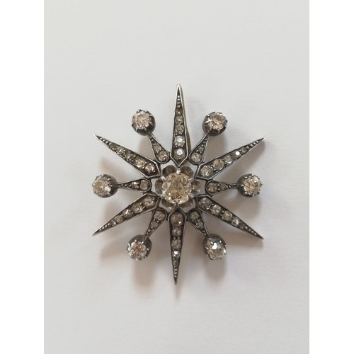 97 - A Victorian diamond necklace, designed as a diamond set starburst brooch pendant, with central old c... 