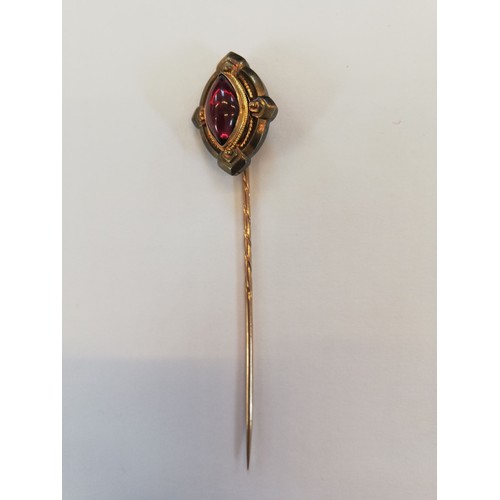 152 - A Victorian 'golden nugget' stick pin, the (untested) nugget measuring 20mm x 12mm, upon a gold colo... 