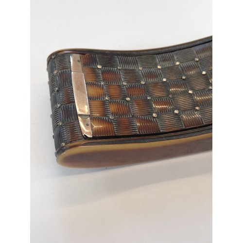 179 - A 19th century tortoiseshell snuff box, of curved rectangular form with chequered decoration, applie... 