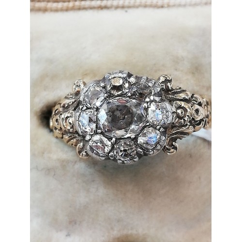 123 - A 19th century diamond floral cluster ring, comprising a central oval old cut diamond measuring 5.3m... 