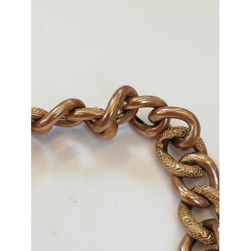 127 - A 9ct gold curb-link bracelet, designed as alternating plain polished and patterned links, 18cm long... 