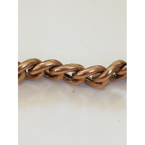 127 - A 9ct gold curb-link bracelet, designed as alternating plain polished and patterned links, 18cm long... 