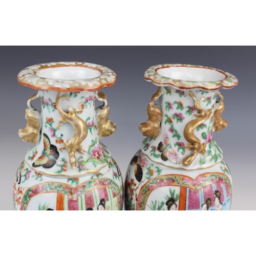 452 - A pair of Chinese Canton vases, late 19th century, each of baluster form and decorated in the famill... 