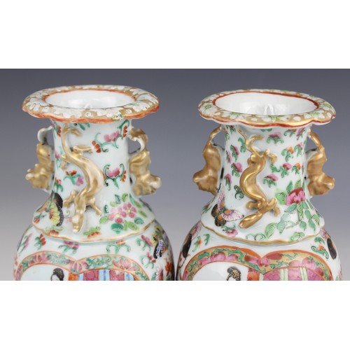 452 - A pair of Chinese Canton vases, late 19th century, each of baluster form and decorated in the famill... 