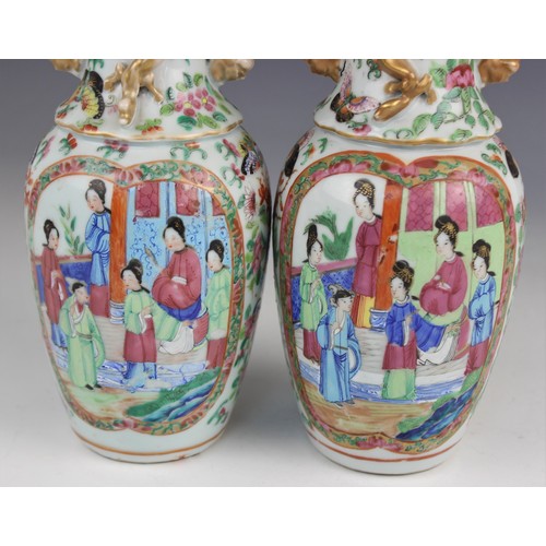 452 - A pair of Chinese Canton vases, late 19th century, each of baluster form and decorated in the famill... 