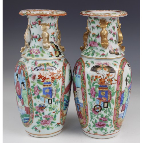 452 - A pair of Chinese Canton vases, late 19th century, each of baluster form and decorated in the famill... 