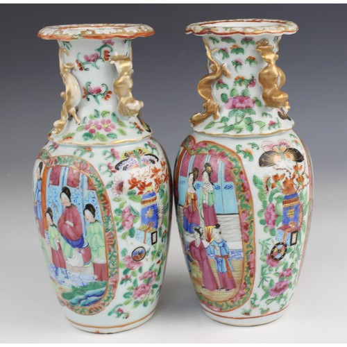 452 - A pair of Chinese Canton vases, late 19th century, each of baluster form and decorated in the famill... 