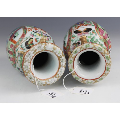 452 - A pair of Chinese Canton vases, late 19th century, each of baluster form and decorated in the famill... 