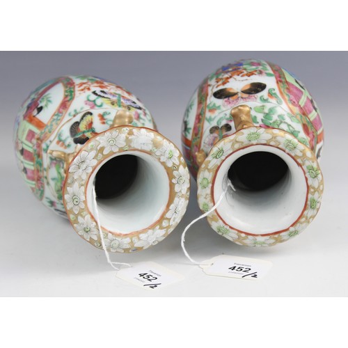 452 - A pair of Chinese Canton vases, late 19th century, each of baluster form and decorated in the famill... 