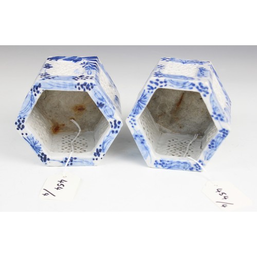 454 - A pair of Chinese porcelain blue and white prunus pattern ginger jars and covers, each of typical gl... 