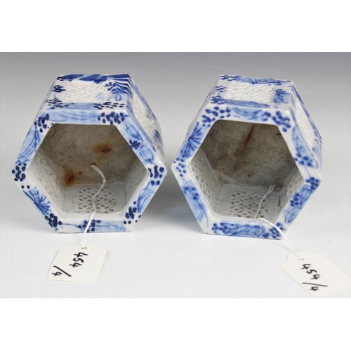 454 - A pair of Chinese porcelain blue and white prunus pattern ginger jars and covers, each of typical gl... 