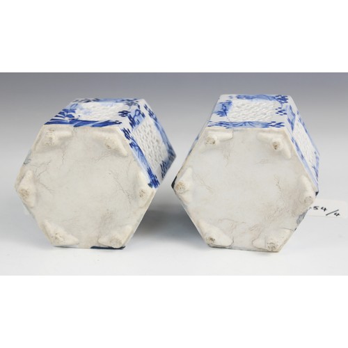 454 - A pair of Chinese porcelain blue and white prunus pattern ginger jars and covers, each of typical gl... 