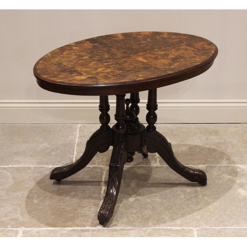 677 - A late Victorian figured walnut occasional table, the quarter veneered oval top raised upon four tur... 