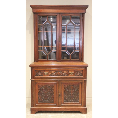 678 - A large 19th century carved walnut secretaire bookcase, the pair of bevelled astragal glazed cupboar... 