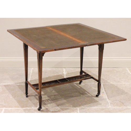 682 - A Victorian rosewood folding games table, the rectangular moulded top raised upon legs of tapering s... 