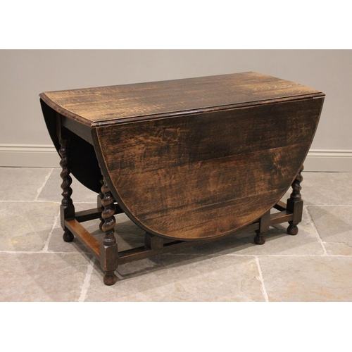 685 - A 17th century style oak drop leaf dining table, late 19th/early 20th century, the moulded oval top ... 